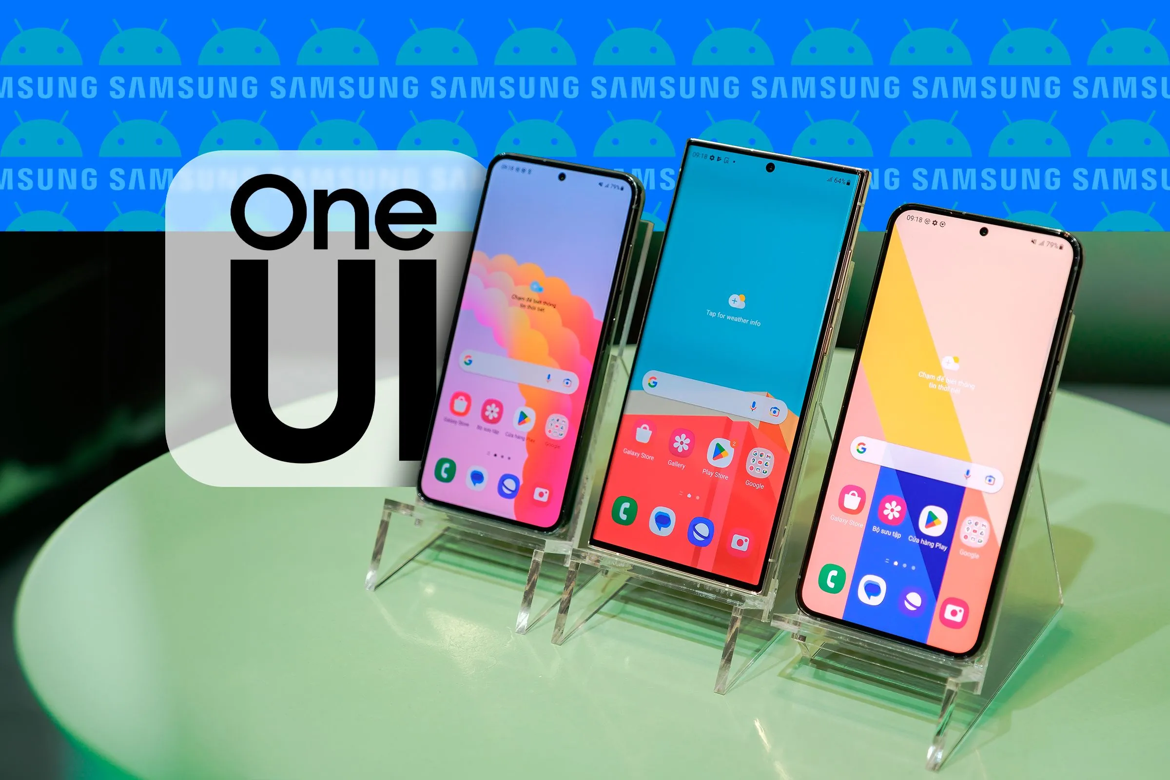 Ba chiếc điện thoại Samsung Galaxy đặt cạnh nhau hiển thị giao diện One UI, cùng với logo One UI, Samsung và Android trong nền.