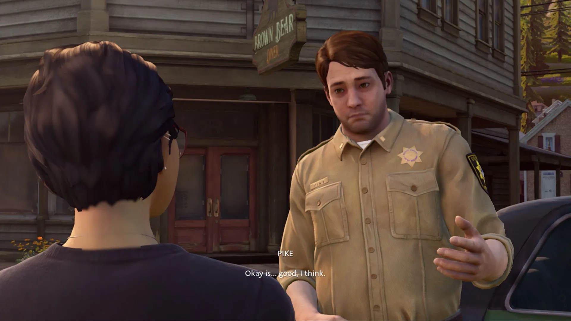 Cảnh đối thoại giữa nhân vật và công dân ảo trong series Life Is Strange, thể hiện sự tập trung vào cốt truyện và lựa chọn.