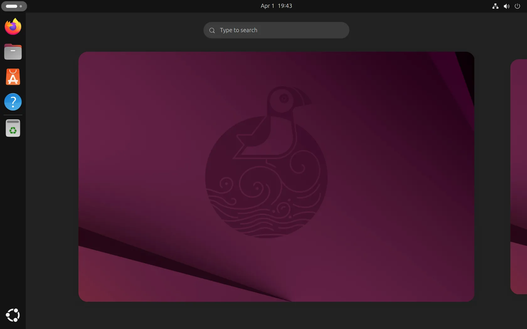Giao diện màn hình nền Ubuntu 25.04 với thanh dock bên trái và các biểu tượng ứng dụng