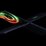 Hai laptop Razer Blade 14 đặt lưng đối lưng, hiển thị thiết kế mỏng nhẹ và màn hình OLED sắc nét, làm nổi bật các cổng kết nối.