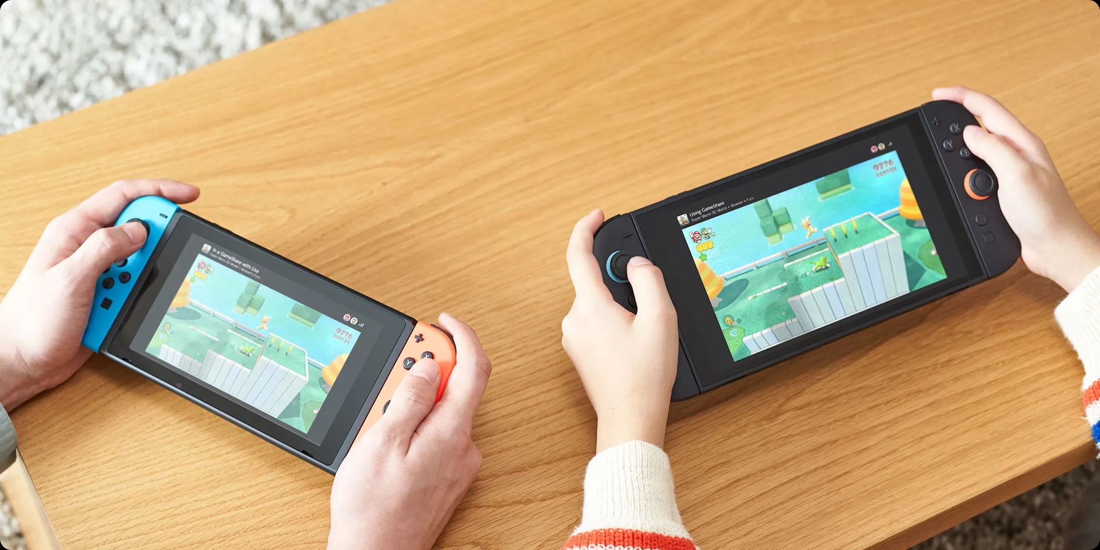 Hai máy chơi game Nintendo Switch (phiên bản cũ và Switch 2) đang sử dụng tính năng GameShare, cho phép chia sẻ trò chơi giữa các thiết bị.