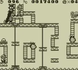Mario né tránh chướng ngại vật trong một màn chơi giải đố của Donkey Kong Game Boy