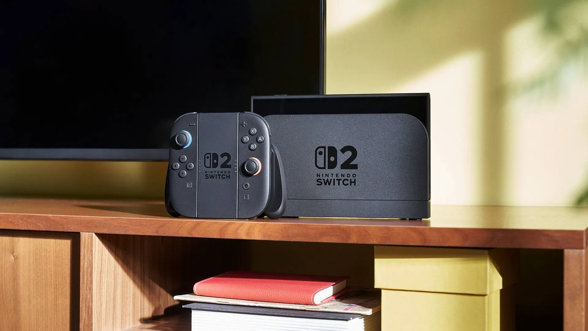 Máy Nintendo Switch 2 cùng Joy-Cons đang được đặt trong dock, kết nối với TV ở chế độ chơi tại gia, thể hiện khả năng xuất hình ảnh độ phân giải cao.