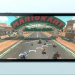 Mô hình máy chơi game Nintendo Switch 2 cùng nhân vật Mario trong game Mario Kart World, minh họa các tựa game ra mắt.