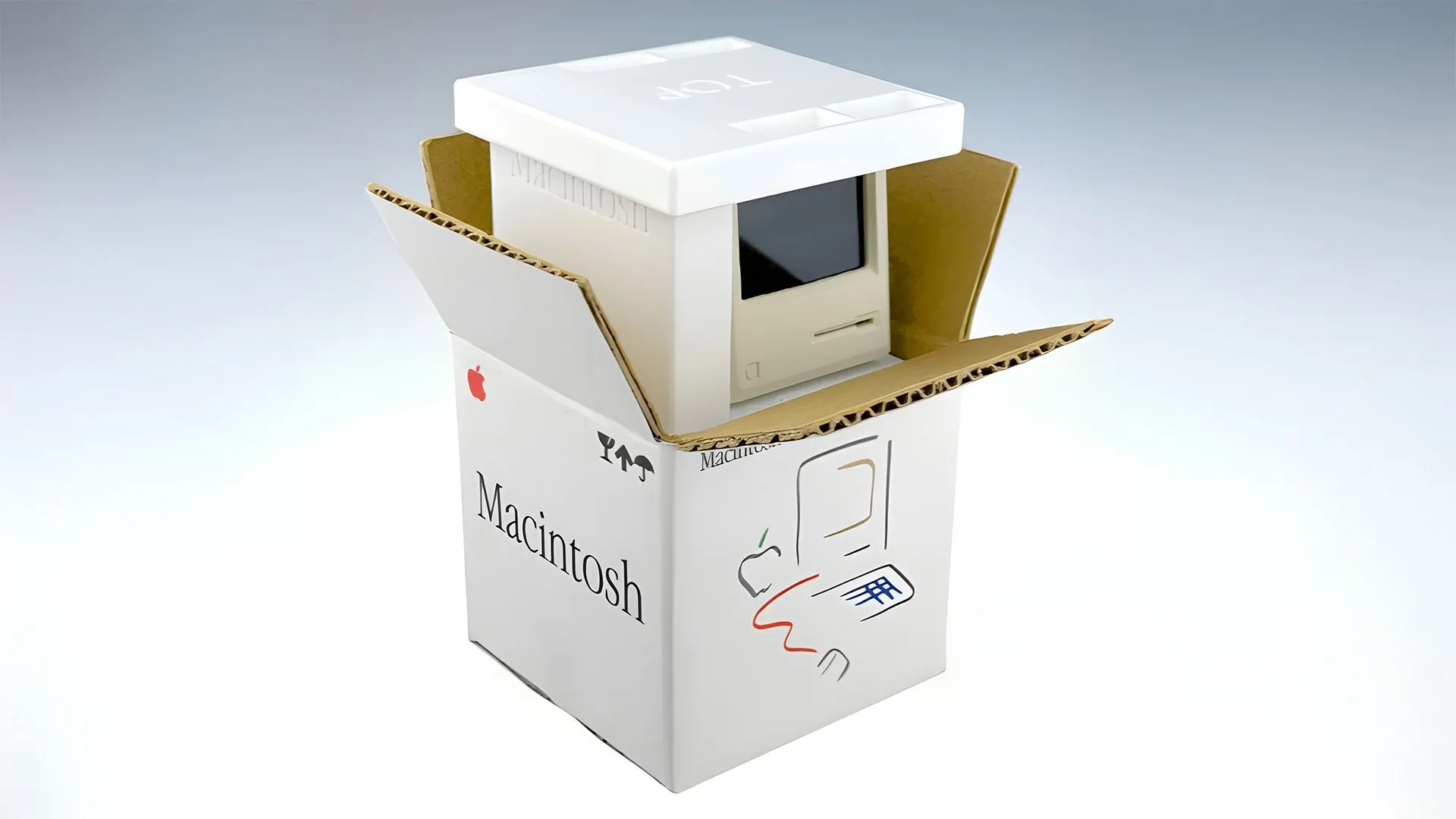 Một bản sao máy tính Macintosh cổ điển tí hon, kích thước bằng ngón tay cái.