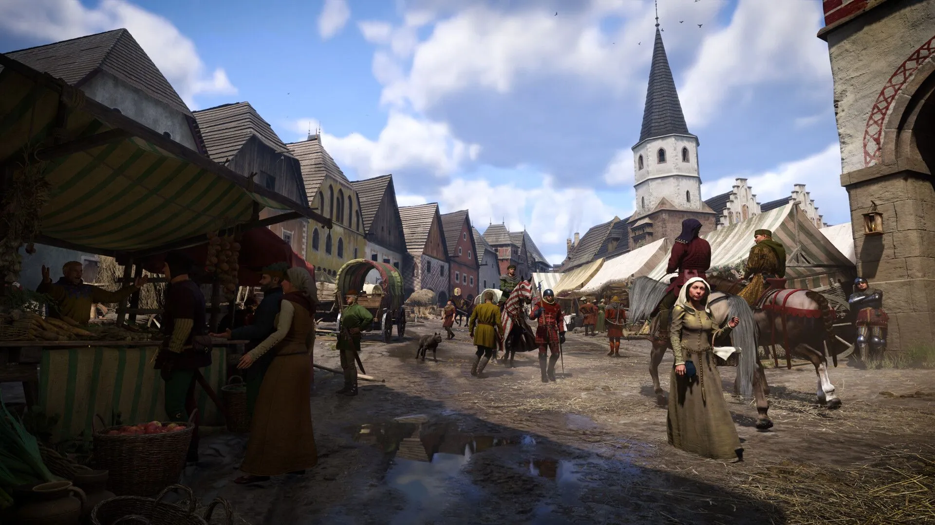 Một cảnh quan rộng lớn của vùng Bohemia thời Trung cổ trong Kingdom Come: Deliverance II, với kiến trúc làng quê và thiên nhiên chân thực, thể hiện sự chính xác lịch sử của game.