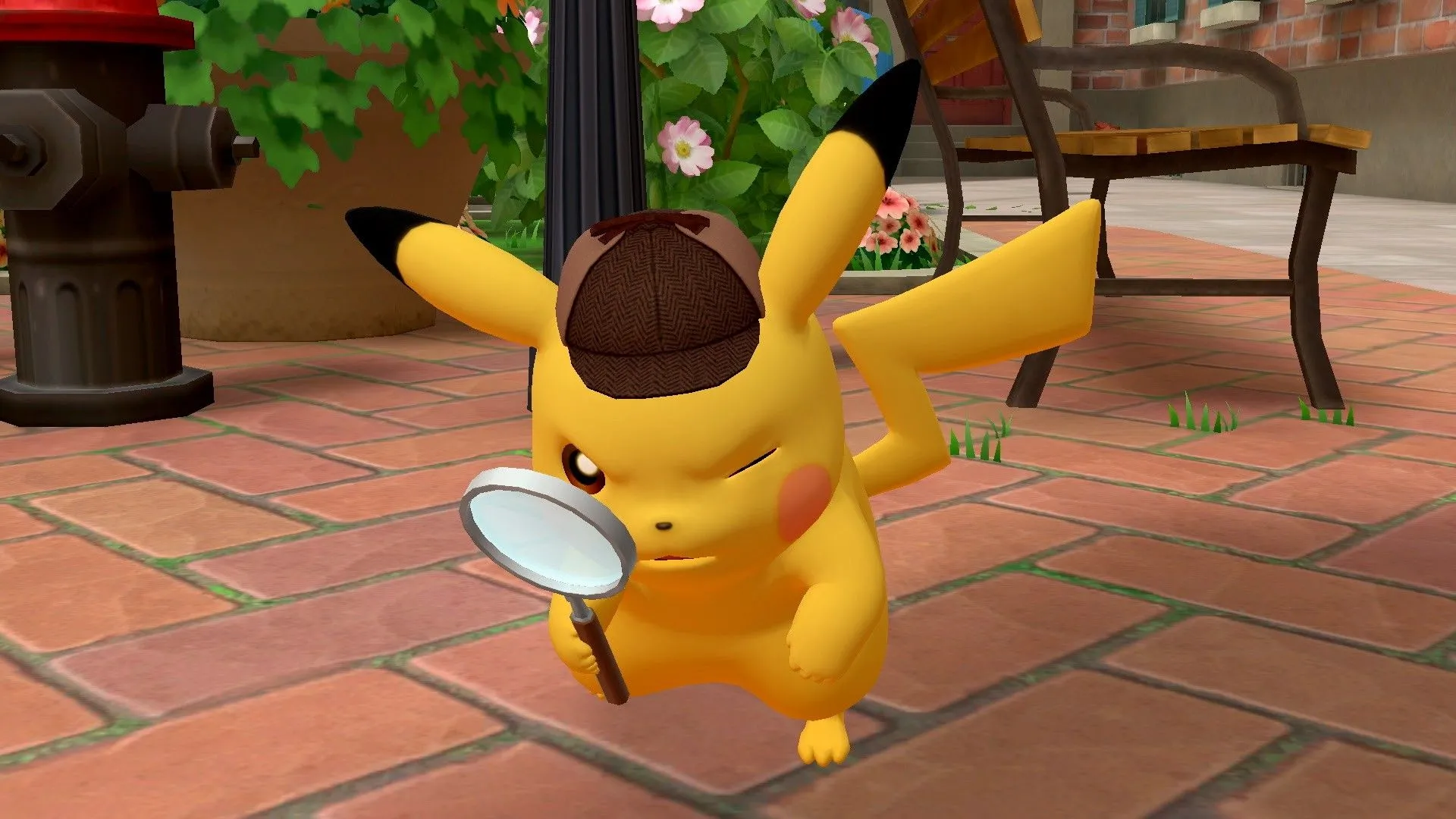 Pikachu đội mũ thám tử và cầm kính lúp, đại diện cho tựa game phiêu lưu Detective Pikachu.